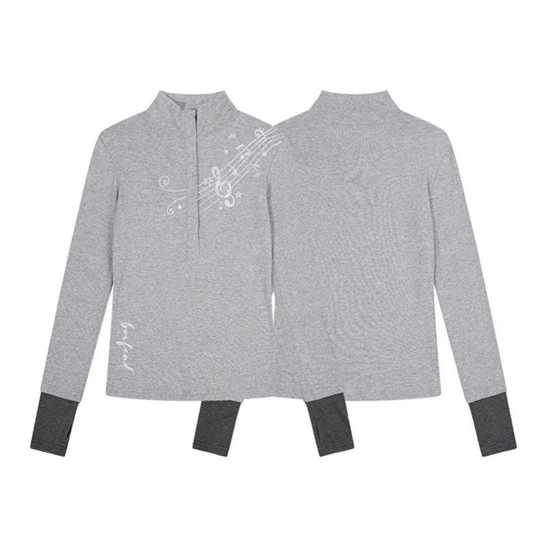 Women’s long-sleeve shirt with Henley button placket, contrast cuffs, and music note print Amarae