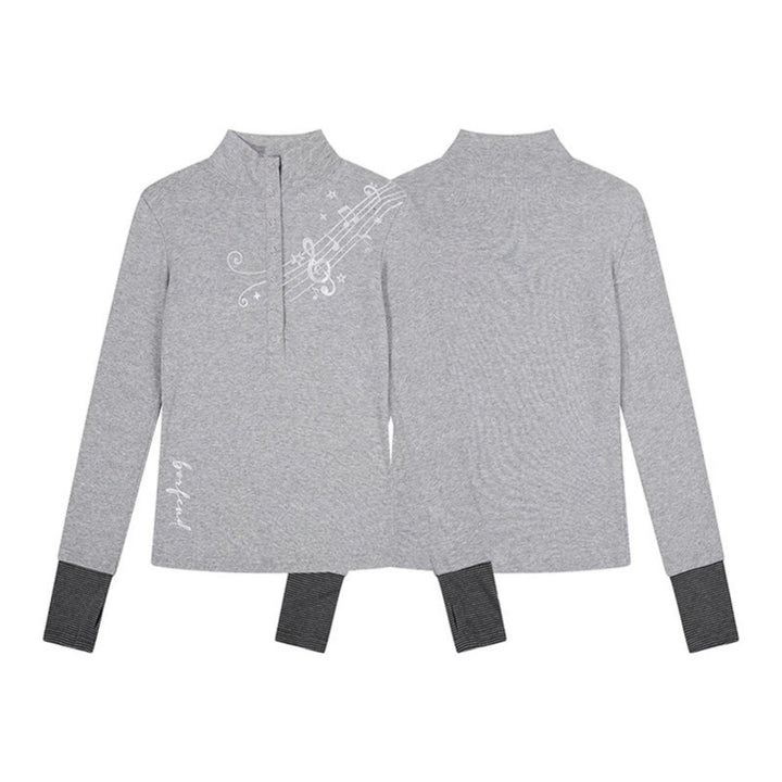 Women’s long-sleeve shirt with Henley button placket, contrast cuffs, and music note print Amarae