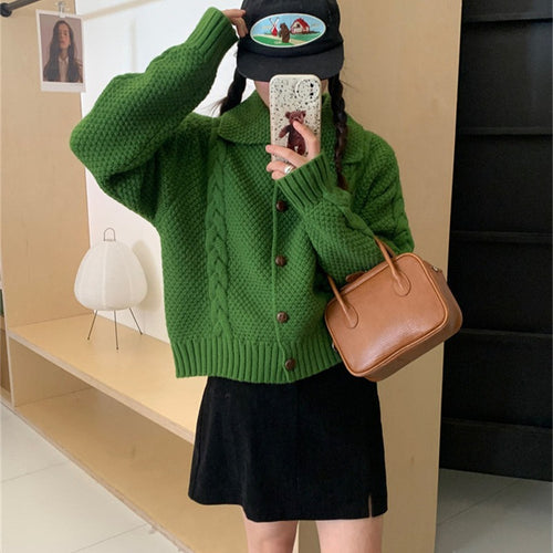 Women's oversized knitted jacket with cable design and chic texture and style