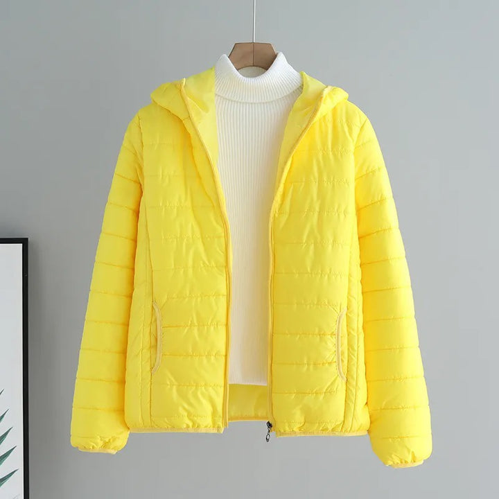 Ladies quilted transitional jacket with practical pockets and hood Amarae