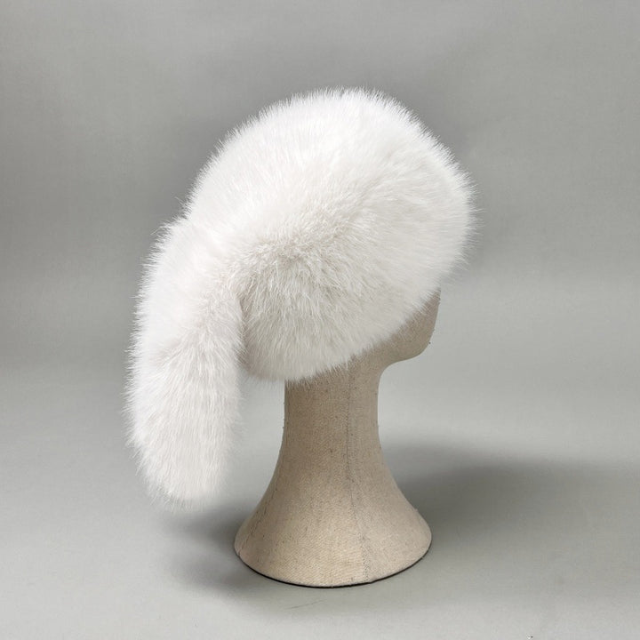 Women’s plush faux fur trapper hat with earflaps and decorative tail Amarae