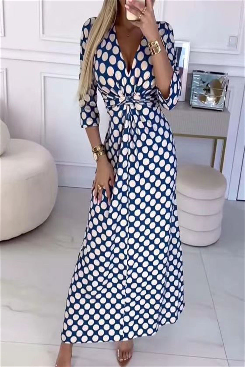 Maxi dress for women with a modern polka dot pattern and an elegant crossover appearance Lune London
