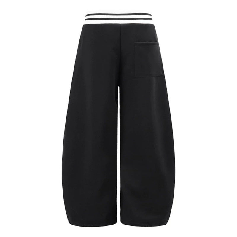 ladies culotte jogging pants with high-contrast waistband, patch pockets, and drawstring hem.