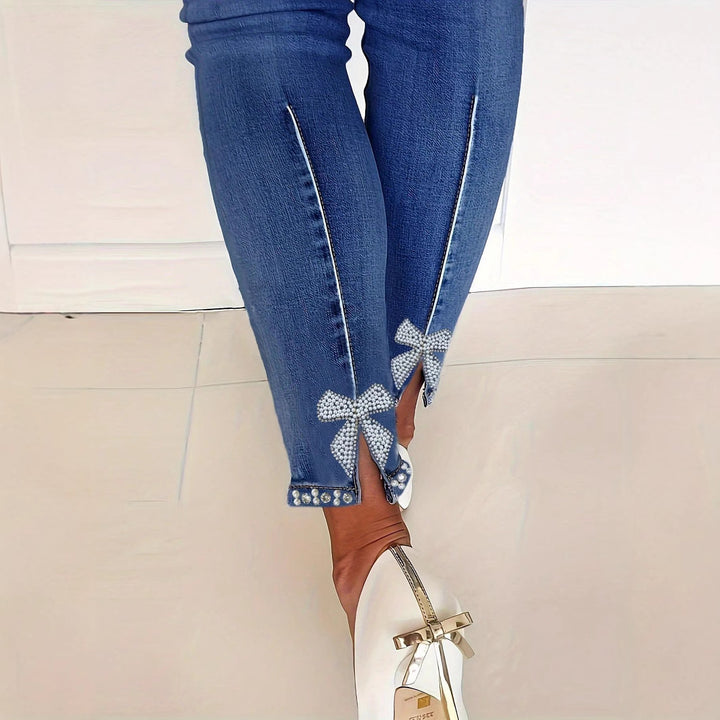 Women's skinny jeans with pearl embellishments and decorative bows Amarae