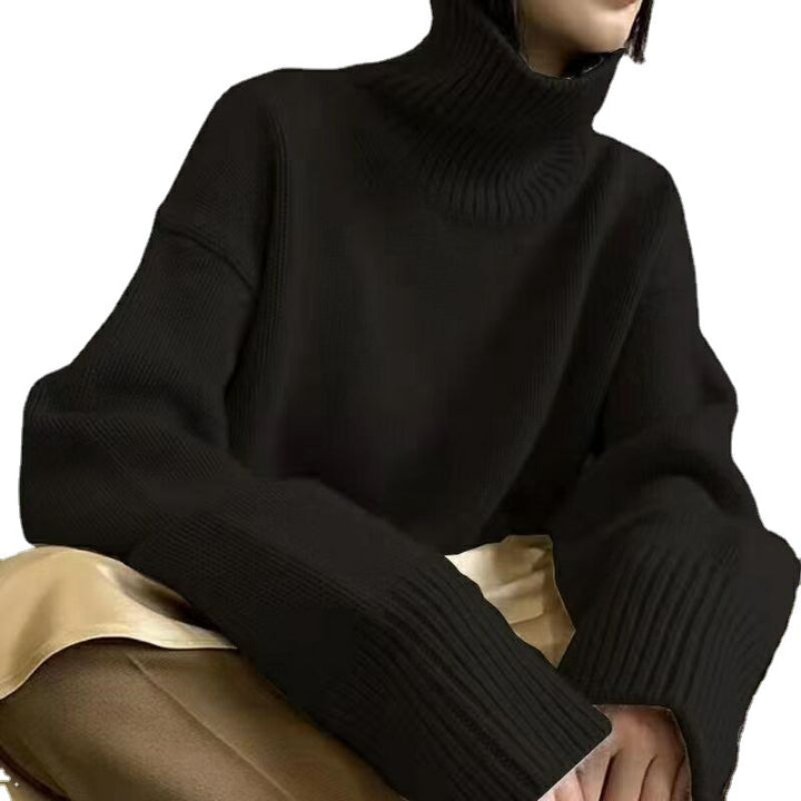 Pull col roulé pour femmes avec des manches larges et une structure en ribbing Chic & Stil