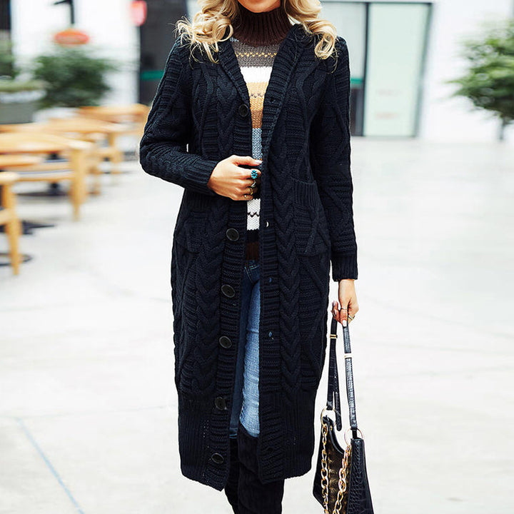 Ladies elegant knit coat with a deep V-neck and an elaborate cable pattern Lune London