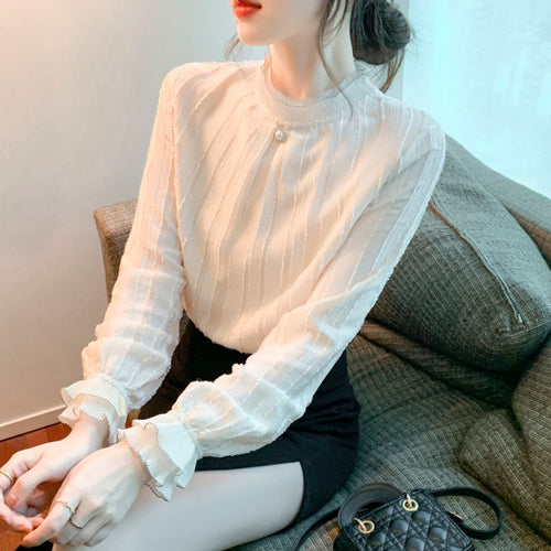Blouse élégante pour femmes avec design texturé et ourlet volé Chic & Stil