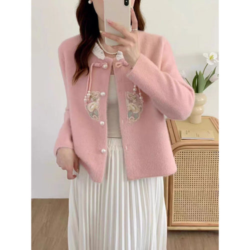 Luxurious knit sweater for women with decorative button details and ruffles Amarae