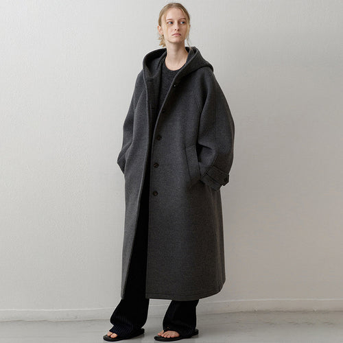 Manteau en laine surdimensionné pour femmes avec capuche et poches pratiques Chic & Stil