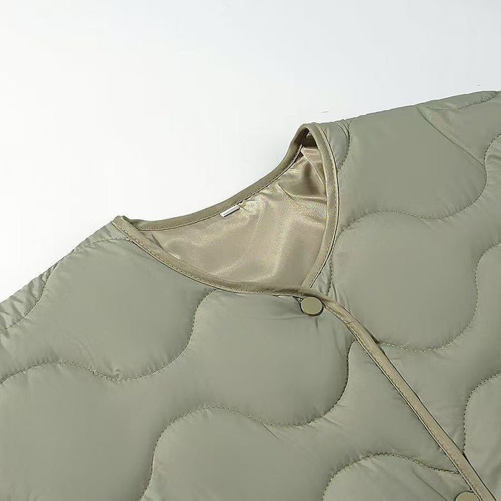 Women's oversized quilted jacket in cocoon cut with wave-shaped quilting and round neckline Amarae