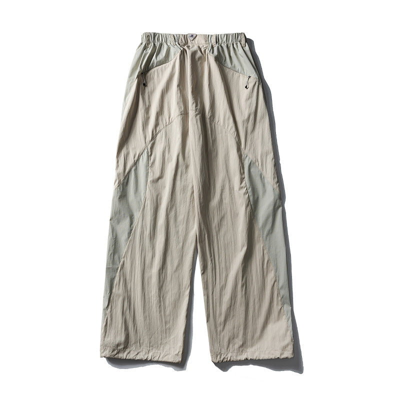 Men's loose technical nylon cargo pants with elastic waistband and panel details Amarae
