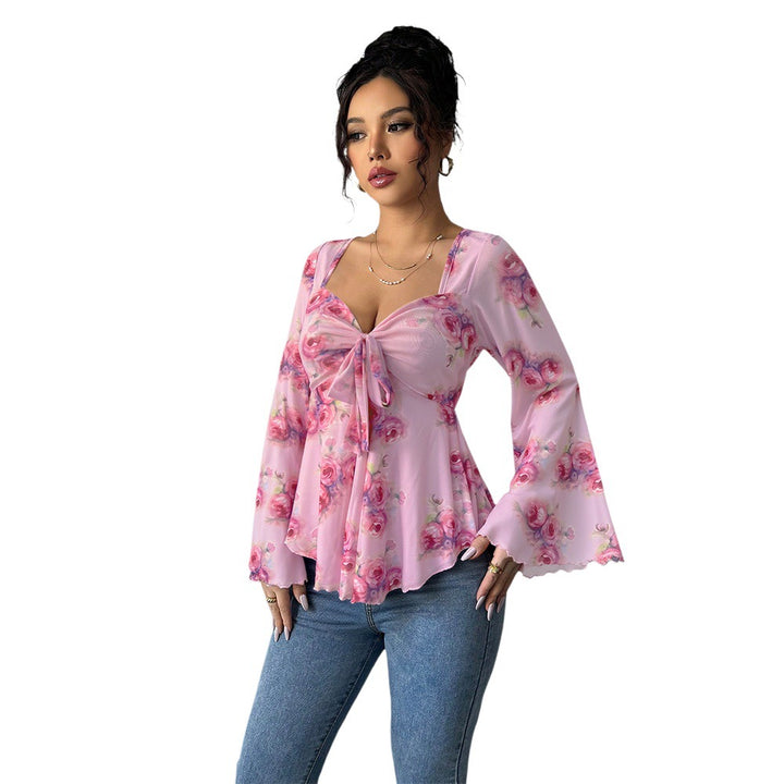 Blouse fluide pour femmes avec motif floral et nœud ludique Chic & Stil