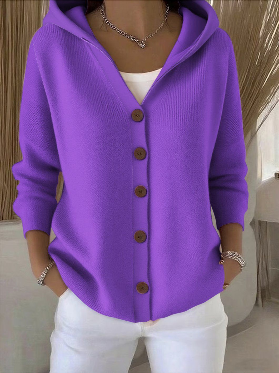 Knitted hooded jacket for ladies with practical button details and a relaxed fit Lune London