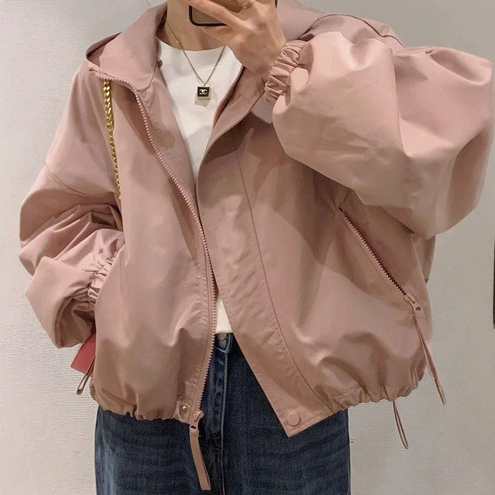 Women's oversized bomber-style hooded jacket with drawstring, elastic cuffs, and side zip pockets Amarae