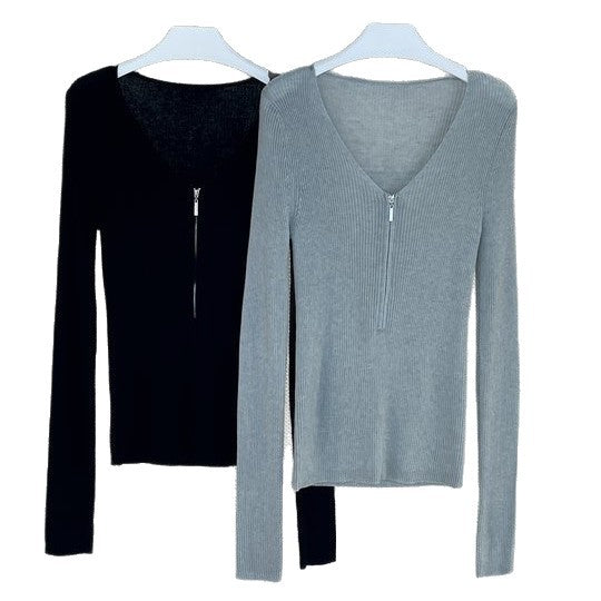 Women's fitted ribbed top with visible zipper at the back