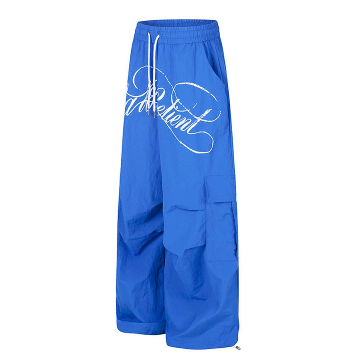 Women's wide palazzo cargo pants with elastic drawstring waistband, large flap pockets, and statement writing print Amarae
