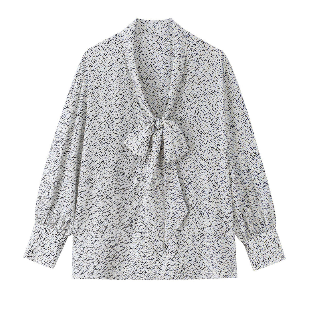 Ladies blouse with peplum and fine polka dot pattern, balloon sleeves and cuffs