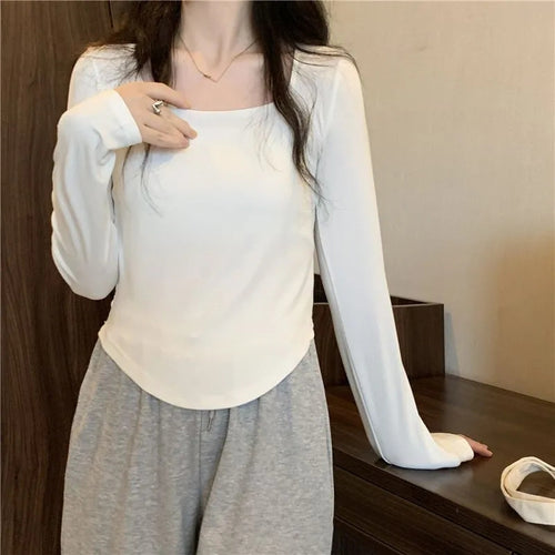 Women's long sleeve top with elegant square neckline and modern cut