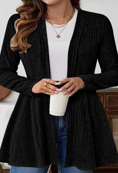 Women’s knitted jacket with a playful design and a chic side belt.