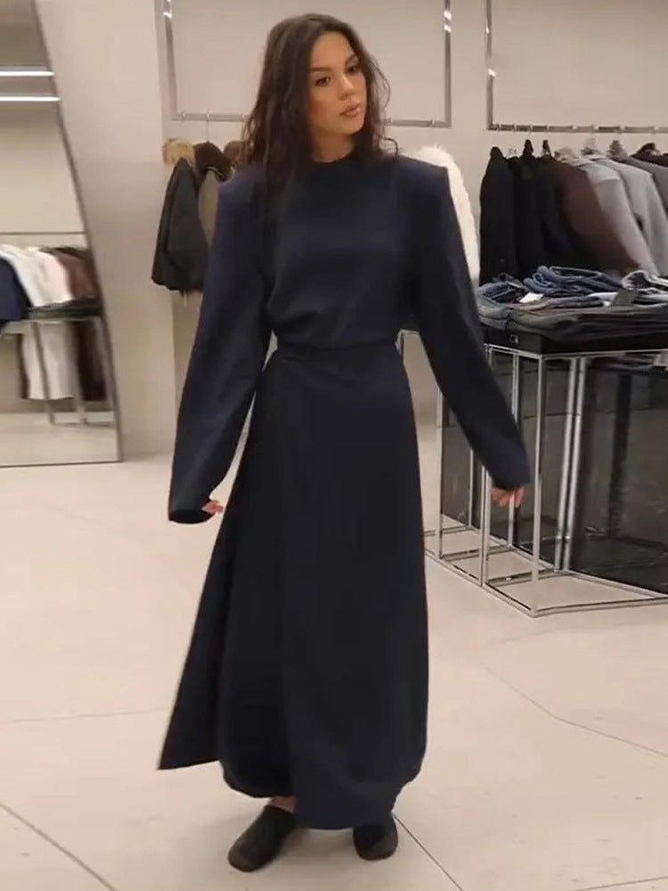 Women’s maxi dress with tailored silhouette, flared skirt and striking shoulders Amarae