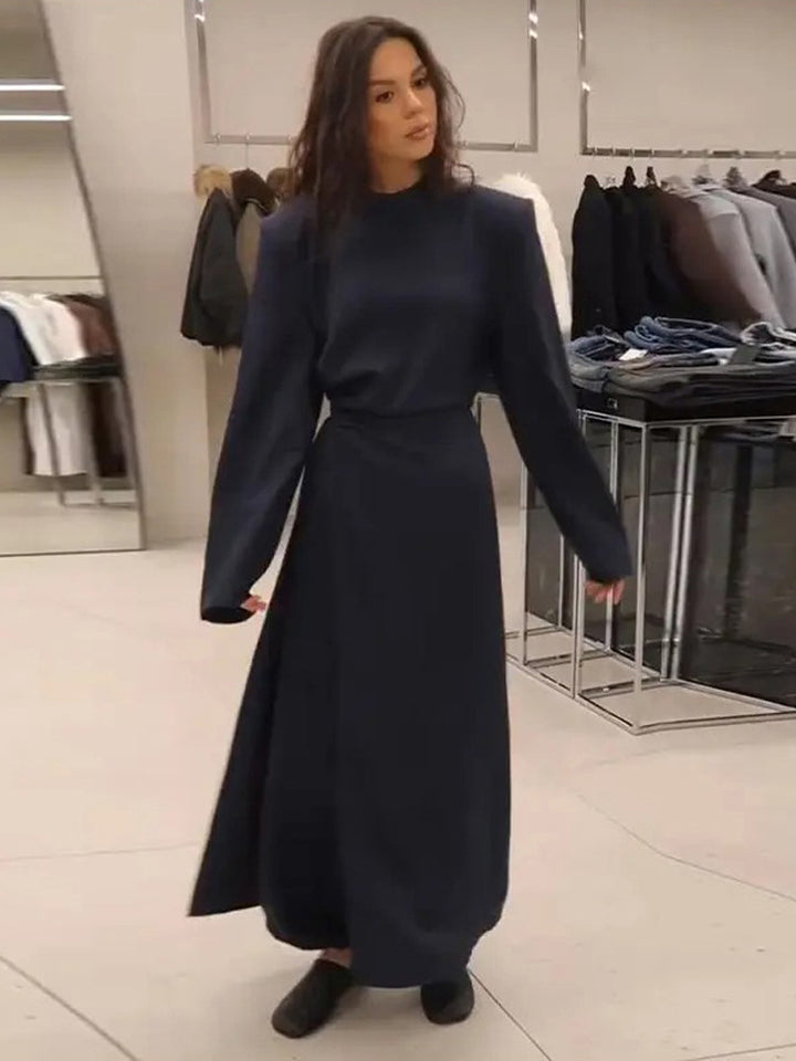 Women’s maxi dress with tailored silhouette, flared skirt and striking shoulders Amarae