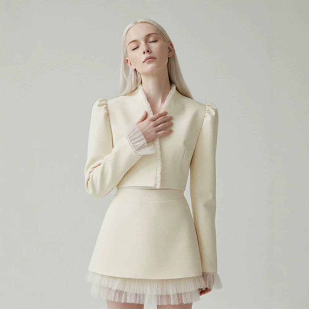 Ladies short blazer with tailored cropped silhouette, gathered shoulders and delicate tulle cuffs Amarae