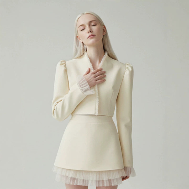 Ladies short blazer with tailored cropped silhouette, gathered shoulders and delicate tulle cuffs Amarae