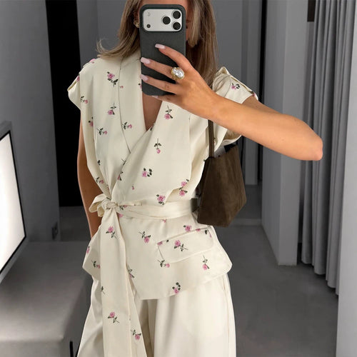 Women's sleeveless wrap blouse with fitted tie belt and patch pockets Amarae
