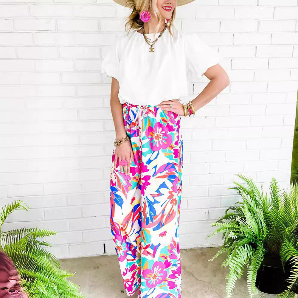 Leisure pants for women, wide, with a colorful floral pattern and an elastic waistband Lune London