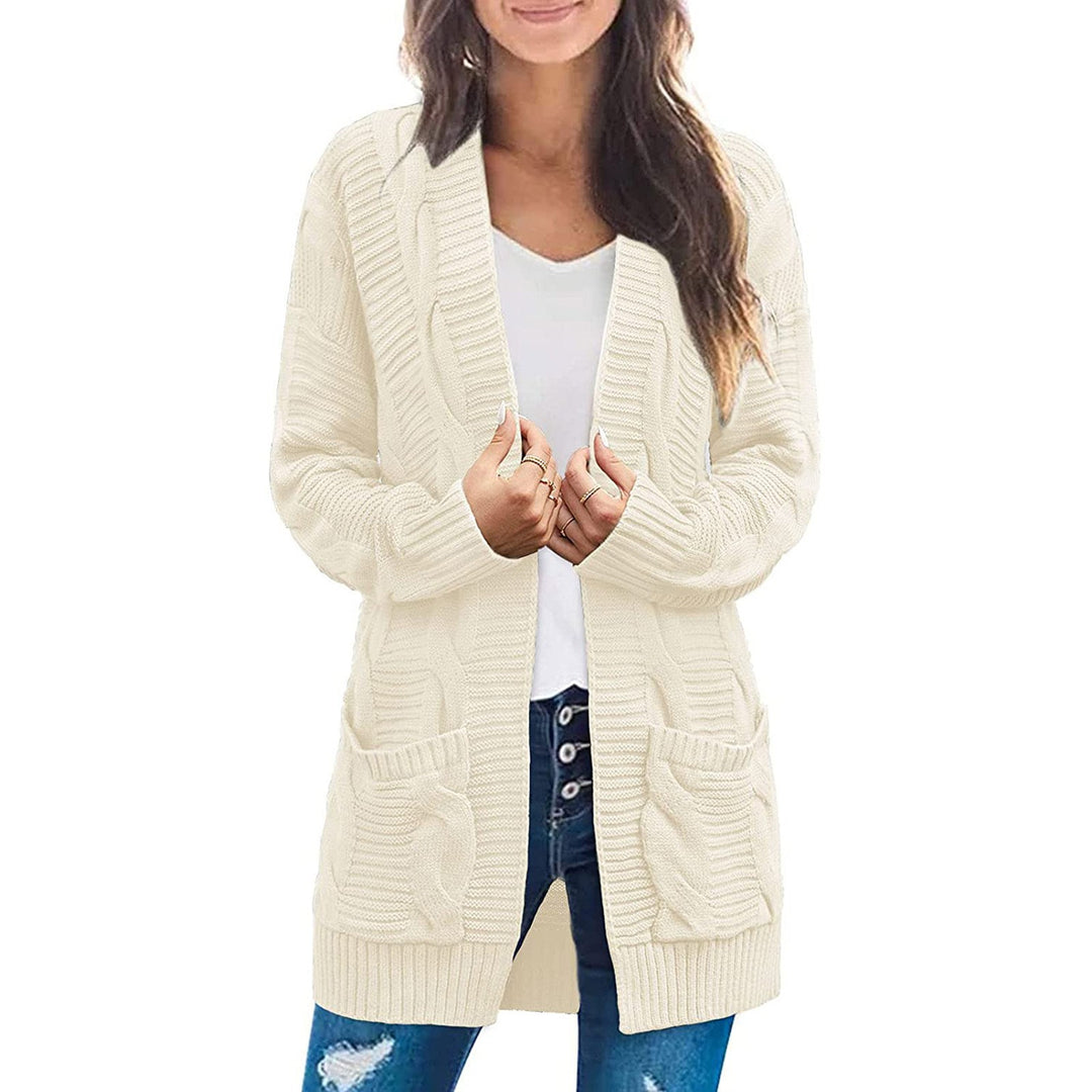 Ladies chunky knit cardigan with elegant cable patterns and practical pockets Lune London