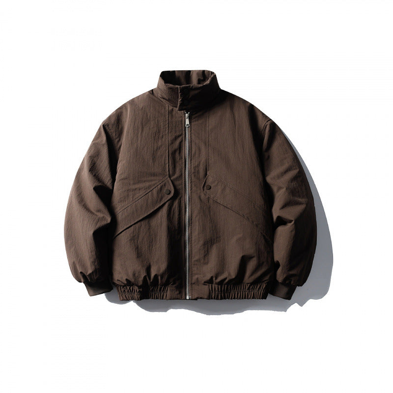 Unisex short boxy isolation jacket with diagonal flap pocket detail and elastic hem Amarae
