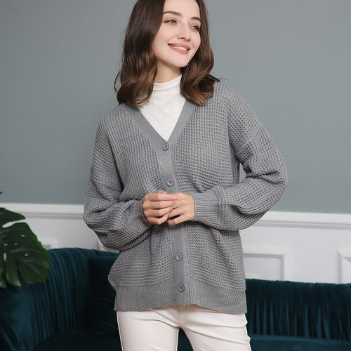 Women's knitted jacket with structured pattern and practical button details Amarae