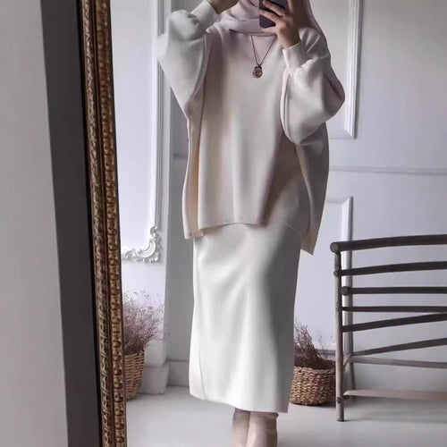 Elegant set for women made up of a casual sweater and a chic midi skirt.
