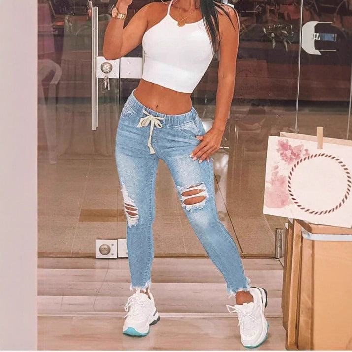 Women High-Waisted Slim Jogger Jeans with Destroyed Inserts and Drawstring Amarae