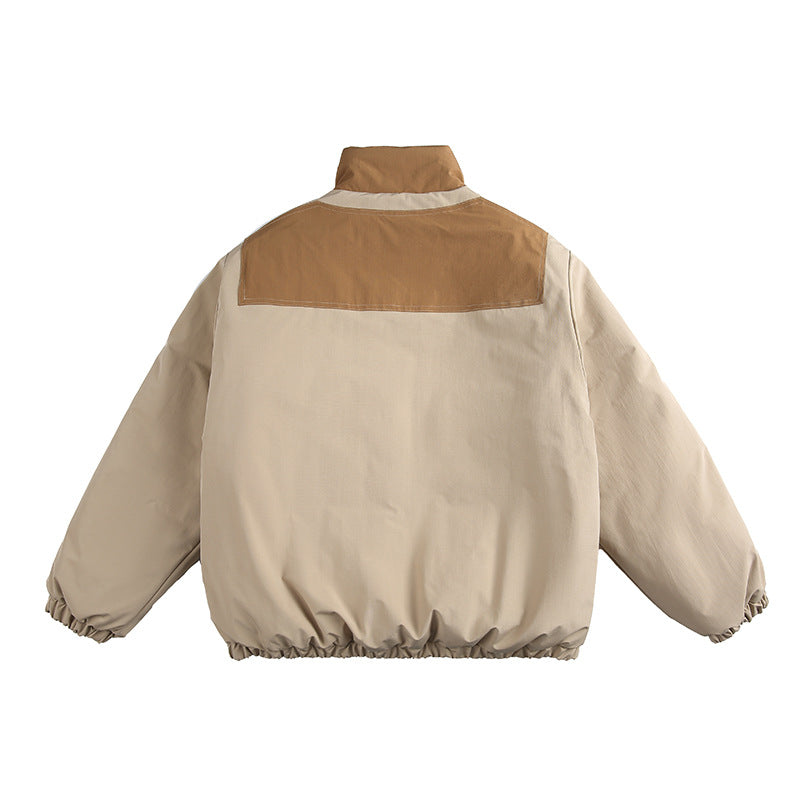 Unisex Boxy padded stand-up collar jacket with contrast panels, vertical chest zippers, and large flap pockets Amarae