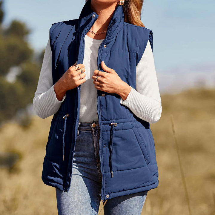 Ladies sleeveless down jacket with high collar and practical zippered pockets Lune Londonl