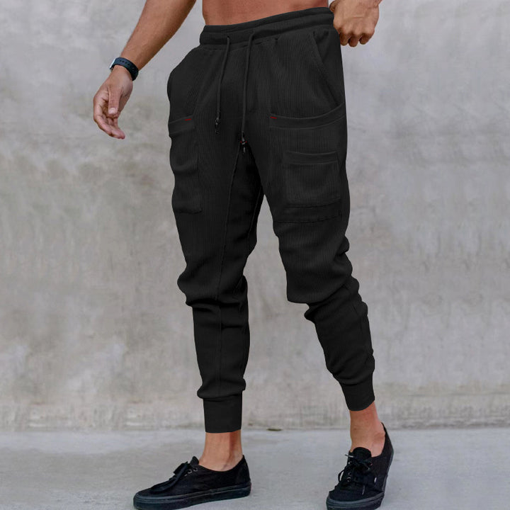 Casual men's jogger pants with practical side pockets and elastic waistband Lune London