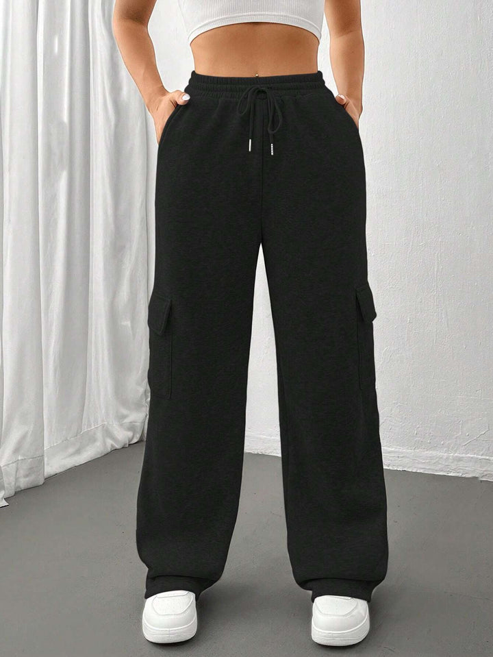 Ladies cargo jogging pants with high elastic waistband, drawstring, and wide leg Amarae