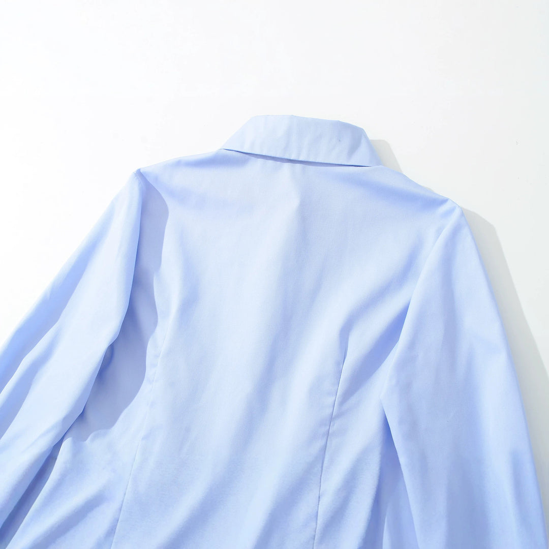 Women's fitted peplum blouse with shirt collar and double-layered hem