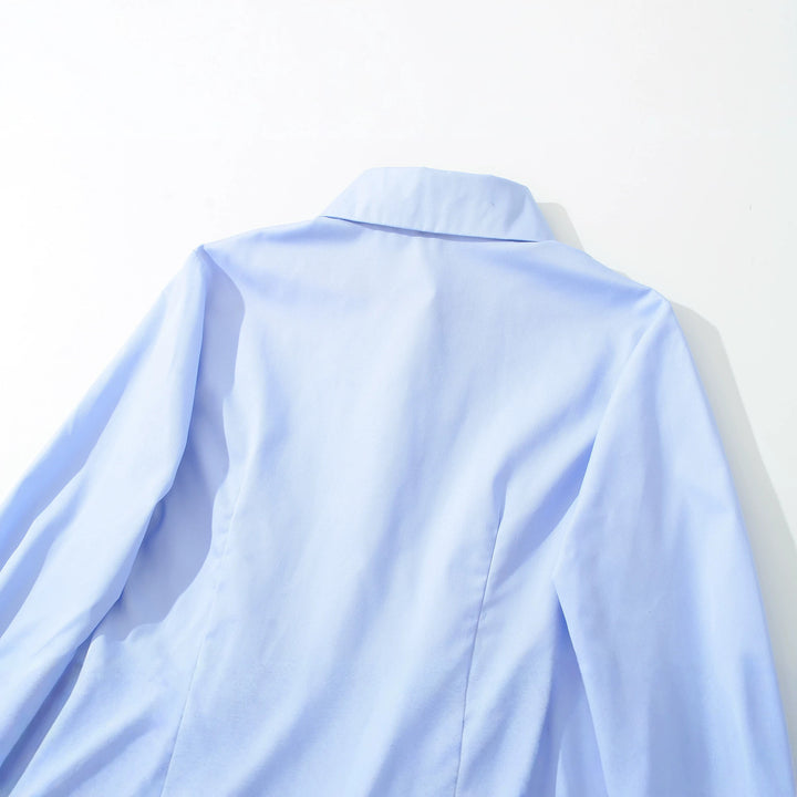 Women's fitted peplum blouse with shirt collar and double-layered hem