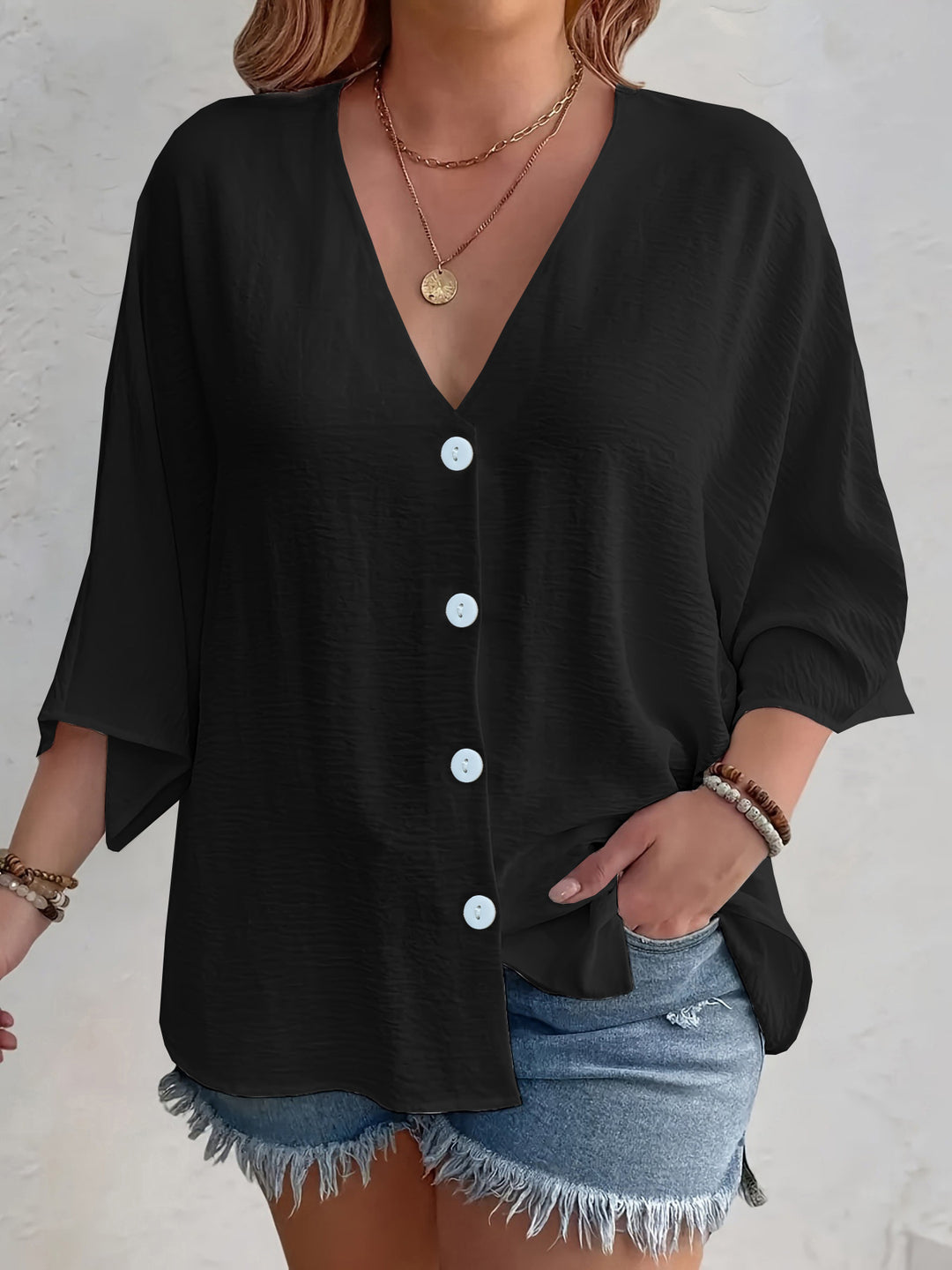 Short-sleeved advantageous blouse for ladies with button placket and V neckline Lune London