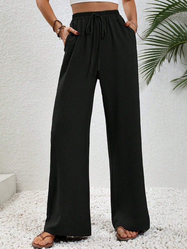 Pantalons larges d'été pour femmes avec taille élastique et poches latérales pratiques Chic & Stil