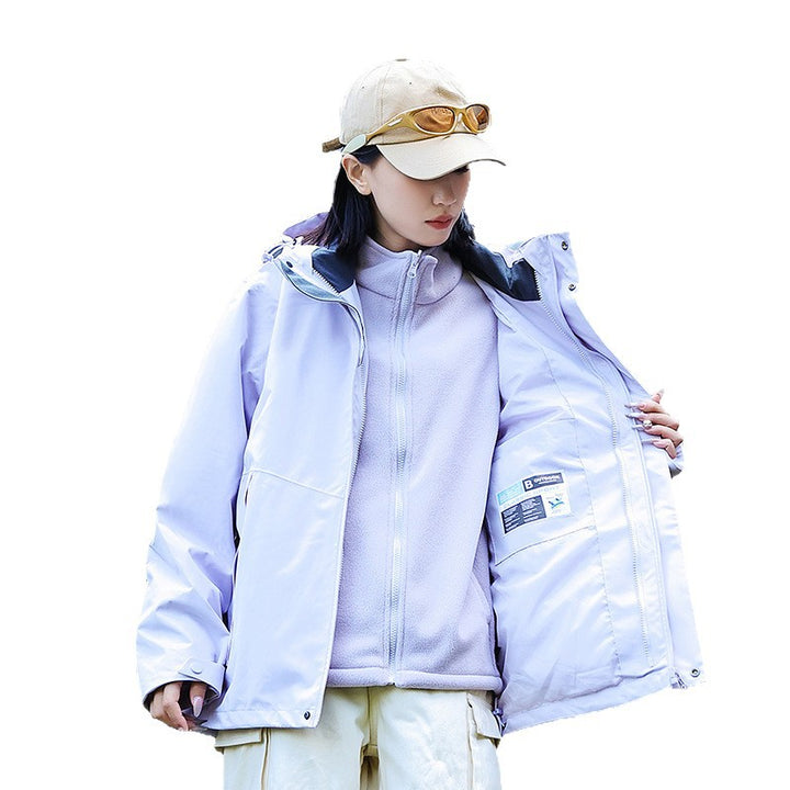 Women’s technical multi-layer hardshell rain jacket with adjustable hood, chest strap, and water-resistant zippers Amarae