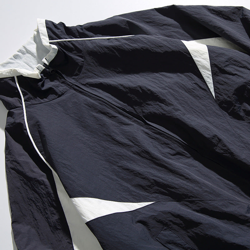 Unisex Lightweight Boxy Hooded Jacket in Windbreaker Style with Contrast Panels and Raglan Sleeves Amarae