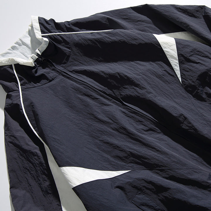 Unisex Lightweight Boxy Hooded Jacket in Windbreaker Style with Contrast Panels and Raglan Sleeves Amarae