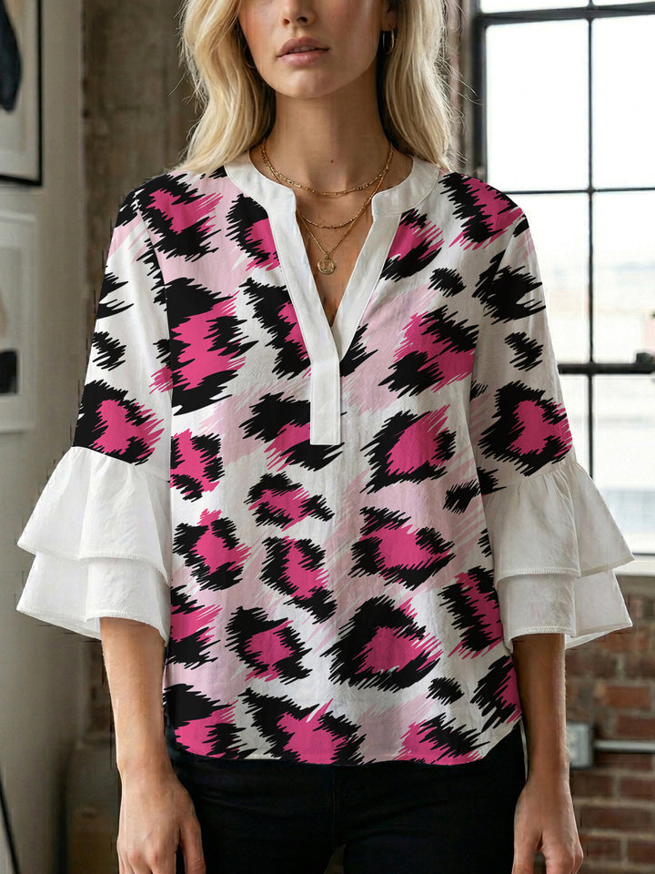 Women's blouse with ruffle details and eye-catching animal print Lune London