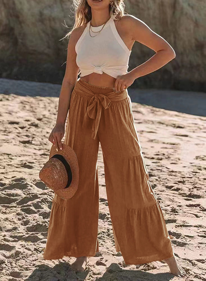 Airy palazzo pants for women with elastic waistband and practical tied belt Lune London