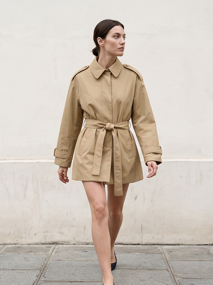 Women's short trench coat with waist belt, shoulder flaps, and adjustable cuffs Amarae