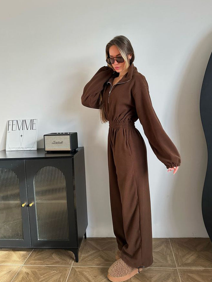 Ladies fleece jumpsuit with large puff sleeves and a high collar Lune London