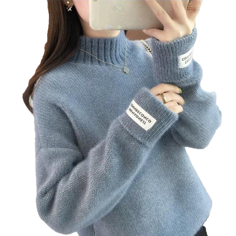 Pull féminin à la mode avec col haut et design texturé Chic & Stil
